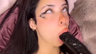 Cute ahegao girl sucks black dildo